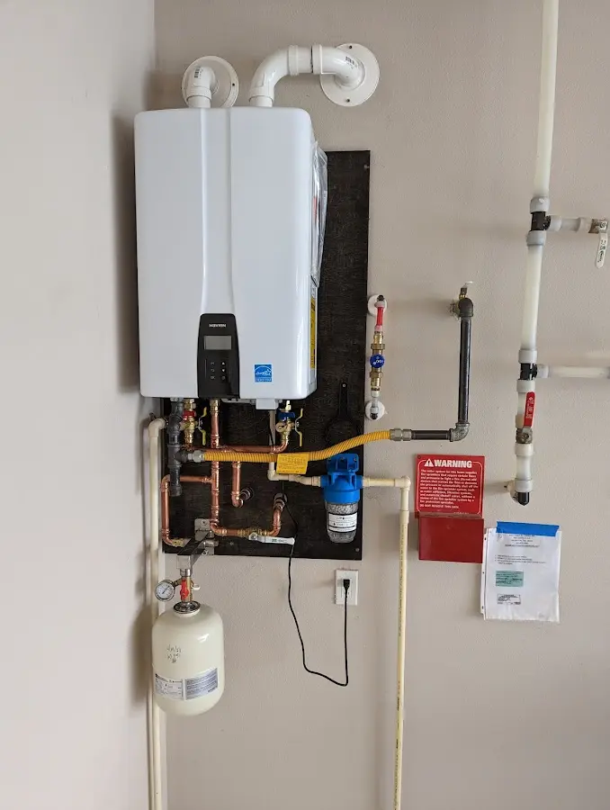 Professional plumber installing copper piping in a Camp Verde home